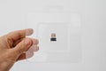 Holding in hand plastic blister with USB Bluetooth 5g transmitter Royalty Free Stock Photo