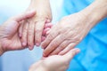 Holding hands Asian senior or elderly old lady woman patient with love, care, encourage and empathy at nursing hospital
