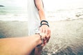 Holding hands on the beach