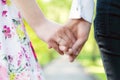 Holding hands close-up. Couple in love dating