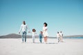 Holding hands, family and children walking on beach to relax on summer holiday, vacation and weekend. Travel, blue sky Royalty Free Stock Photo