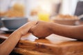 Holding hands, prayer and dinner table with gratitude at family lunch with food and worship. Thanksgiving, holiday and Royalty Free Stock Photo