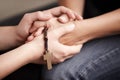 Holding hands, prayer together with beads and help for religion, trust and spiritual hope. Support, counseling and Royalty Free Stock Photo