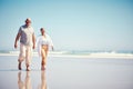 Holding hands, summer and an old couple walking on the beach with a blue sky mockup background. Love, romance or mock up Royalty Free Stock Photo