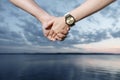 Holding hands on the sunset Royalty Free Stock Photo