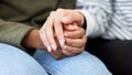 Holding hands, support and closeup of a couple in therapy for love, respect or trust in marriage. Together, hope and