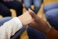 Holding Hands in Support Group Close up