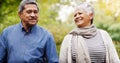 Holding hands, walking and senior couple in park for bonding, commitment and loving relationship. Retirement, marriage Royalty Free Stock Photo