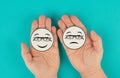 Holding a head with a sad and a happy face in the hands, mental health concept, positive and negative mindset, depression, support Royalty Free Stock Photo