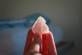 Holding a healing rose crystal or a gemstone. A lovely pink love stone bring good vibes and positive vibrations