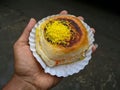 Holding Indian street food dabeli, kutchi dabeli