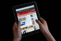 Holding an ipad while reading the BBC news Royalty Free Stock Photo