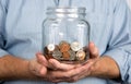 Holding A Jar Of Coins Money Royalty Free Stock Photo