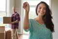 Holding the keys to their dream home. a young couple moving into their new home. Royalty Free Stock Photo