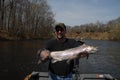 Holding large steelhead Royalty Free Stock Photo