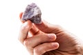 Holding a lepidolite piece Royalty Free Stock Photo