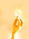 Holding a light bulb Royalty Free Stock Photo