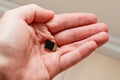 Holding micro SDHC card in a hand - shallow focus Royalty Free Stock Photo