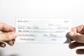 Holding a million dollar bank check isolated in a white background Royalty Free Stock Photo