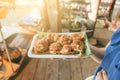 Holding mini Fried Mussels in Batter,Floating market