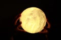 Holding mystik yellow moon with hands Royalty Free Stock Photo