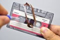 Holding an old audio cassette to align the magnetic tape with pen Royalty Free Stock Photo