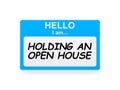 Holding an open house tag Royalty Free Stock Photo