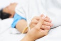 Holding patient hand in hospital Royalty Free Stock Photo