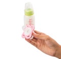 Holding Pink Pacifier and Infant Formula