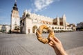 Holding prezel in Krakow city Royalty Free Stock Photo