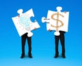Holding 2 puzzles with bulb and money symbol drawing Royalty Free Stock Photo