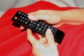 Holding remote control with two hands Royalty Free Stock Photo