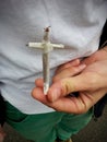 Holding a Rolled Cigarette in the Shape of a Cross: Power in the Hand Royalty Free Stock Photo