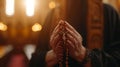 and holding rosary against cross and praying to God at church. Royalty Free Stock Photo