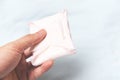 Holding Sanitary napkin or feminine sanitary pad on hand - Female hygiene means women Period Product absorbent sheets