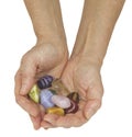 Holding a set of chakra healing crystals