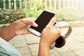 Holding smartphone and headphones Royalty Free Stock Photo