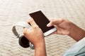 Holding smartphone and headphones Royalty Free Stock Photo