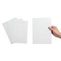 Holding a stack of blank white paper sheets Royalty Free Stock Photo