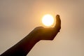 Holding the sun in the palm Royalty Free Stock Photo