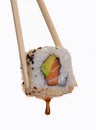 Holding sushi roll. Royalty Free Stock Photo