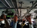 Holding on tight to the handrail in the local Mumbai train.