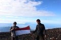 holding at the top of Mount Fujiyama Japan