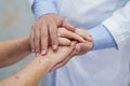 Holding Touching hands Asian senior or elderly old lady woman patient with love, care, helping, encourage and empathy Royalty Free Stock Photo