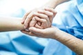 Holding Touching hands Asian senior or elderly old lady woman patient with love, care, helping, encourage and empathy at nursing h