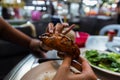 Holding up a black pepper crab claw Royalty Free Stock Photo