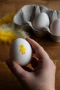 Person holding up an egg for Easter breakfast Royalty Free Stock Photo