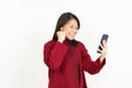 Holding and Using Smartphone of Beautiful Asian Woman Wearing Red Shirt Isolated On White Royalty Free Stock Photo