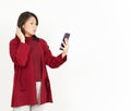 Holding and Using Smartphone of Beautiful Asian Woman Wearing Red Shirt Isolated On White Royalty Free Stock Photo