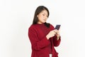 Holding and Using Smartphone Of Beautiful Asian Woman Wearing Red Shirt Isolated On White Royalty Free Stock Photo